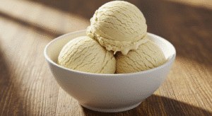 Homemade 3-ingredient vanilla ice cream scoops in white bowl